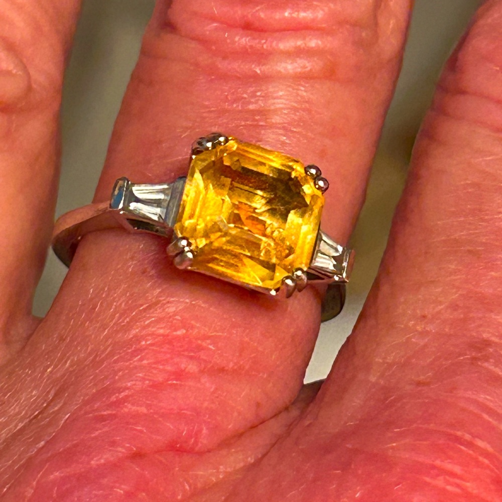 Sterling silver Citrine ring with diamond baguette accents.